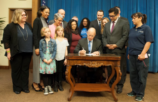 Photo of California Governor signing legislation